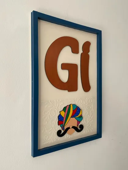 Another angle of the 'Gi' house number plate. The simple design combined with the colorful, hand-painted element creates a very elegant look.