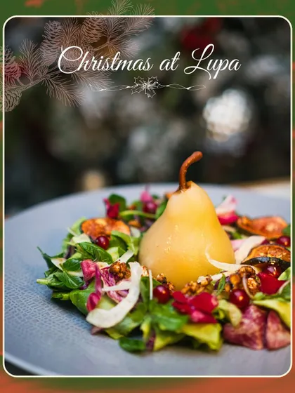 The stunning Riesling Poached Pear Salad from our Christmas menu. The presentation is as important as the flavor, especially during the holidays.