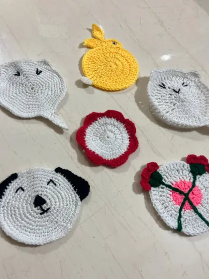 Another view of the charming animal and floral themed tea coasters, perfect for protecting surfaces with a bit of personality.