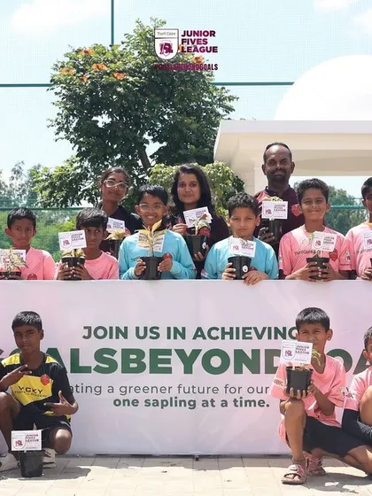 A team poses with their saplings and trophies. My events celebrate victory on the field and responsible citizenship off it.
