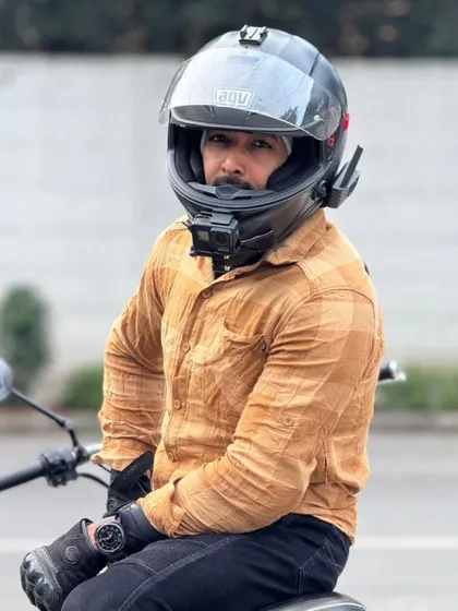 Geared up and ready to capture the ride. The helmet-mounted camera setup allows me to document our journeys safely.