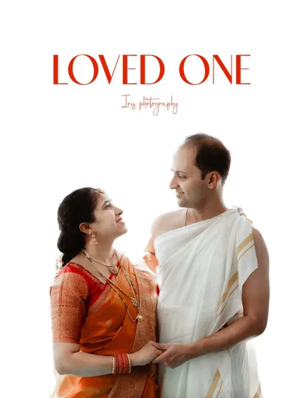 A classic portrait of a couple dressed in traditional South Indian attire for their child's naming ceremony. The clean, white background puts all the focus on their happy expressions.
