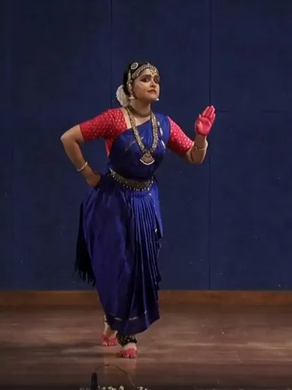 This dynamic stance is part of a sequence of pure dance, or 'Nritta'. It showcases the crisp footwork and rhythmic patterns that are fundamental to Bharatanatyam.