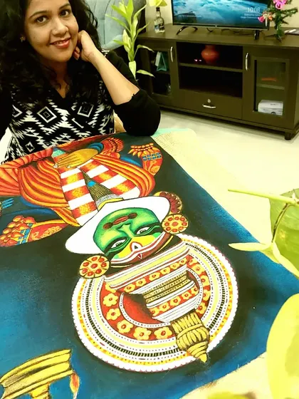 Taking a moment with an unframed Kathakali painting. At this stage, the colors are all laid down, and you can see the powerful expression of the character taking shape before it gets framed and ready for display.