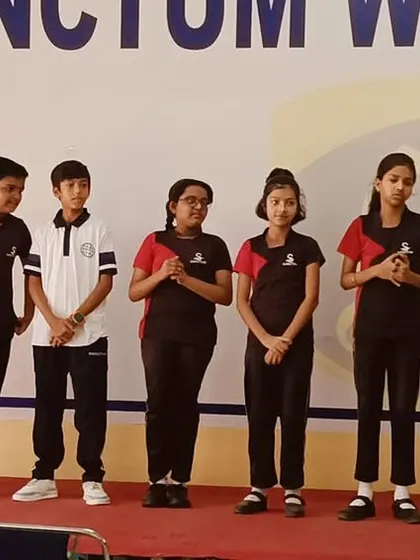 Students on stage demonstrating their skills during a school workshop. This is a powerful way to show results.