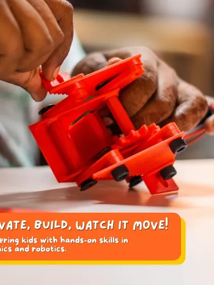 A close-up of a student assembling the gear mechanism of an insect bot. This project is a great introduction to mechanics, teaching how gears transfer motion.