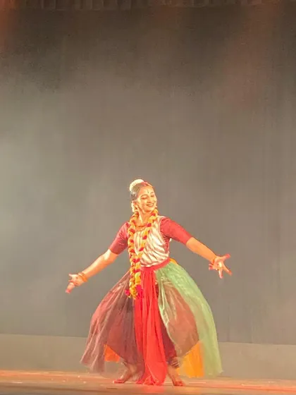 The costume for the Dhunuchi Naach segment, featuring a multi-colored skirt and floral garland to represent the changing colors of autumn leaves. Costume design is an integral part of my production process.