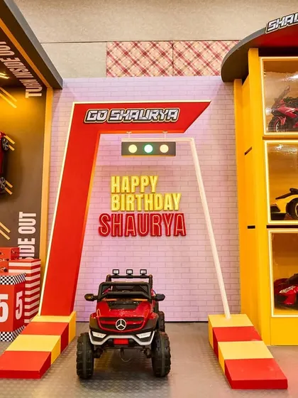 Welcome to Shaurya's Garage. I created this high-energy entrance for a race car theme party, featuring a starting line, traffic lights, and a mini Mercedes, promising a day full of speed and excitement.