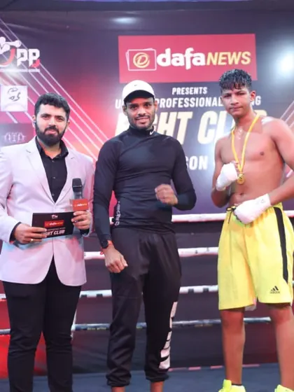 Posing with a winner at a United Professional Boxing event hosted at our academy. We bring high-level boxing to our community.