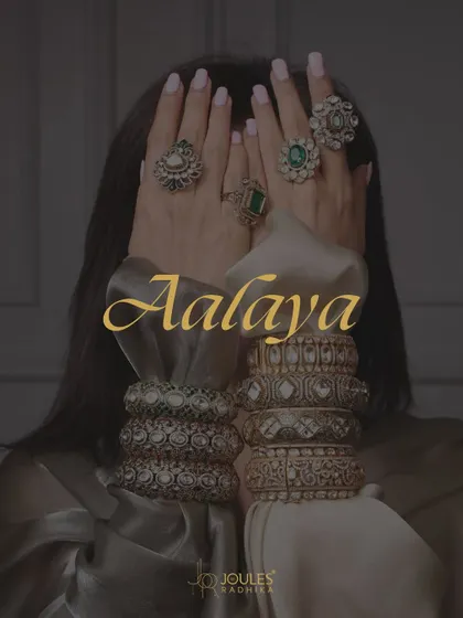 Unveiling Aalayaa. This moody shot features hands adorned with stacked bangles and multiple rings, hiding the face to put the focus on the jewelry.