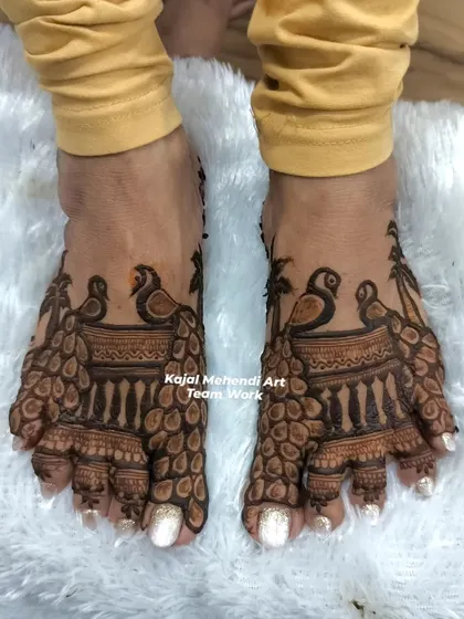 We also do beautiful foot mehndi for the wedding party. This peacock design for the feet complements the hand mehndi perfectly.