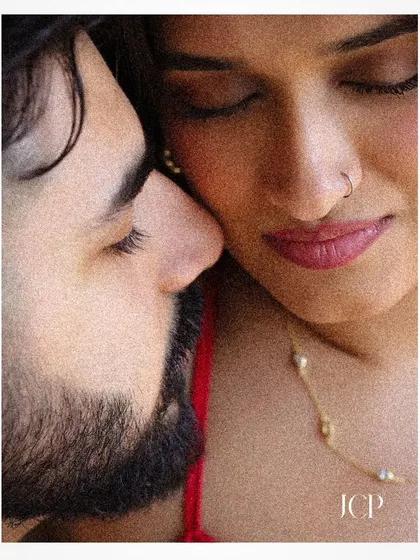 An intimate close-up from a Goa pre-wedding shoot, focusing on the couple's connection.