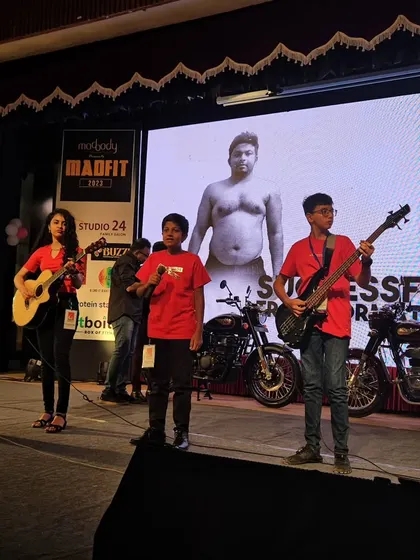 More action from the Madfit 2023 concert, with our students on vocals and bass guitar, performing in front of a large LED screen.