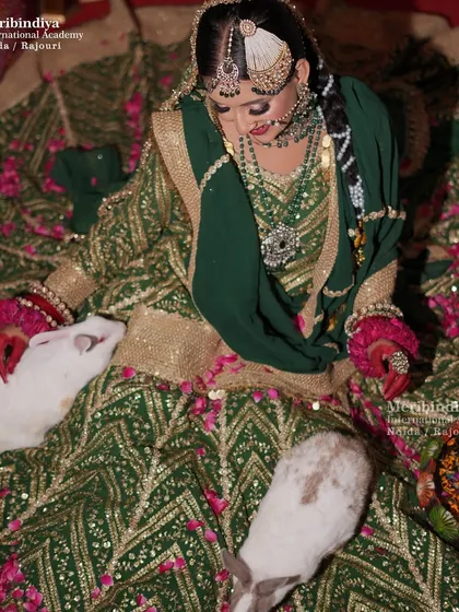 An overhead view that gives a unique perspective on the bridal hairstyle and the spread of the magnificent lehenga.