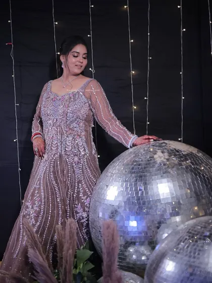 Ready for the party. This full-length shot shows how the makeup and outfit come together for a stunning sangeet or reception look.