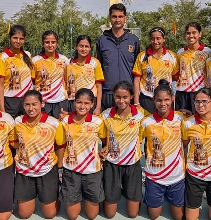 The Mumbai University women's basketball team with Head Coach Sylvan Desmond, ready for the West Zone tournament.