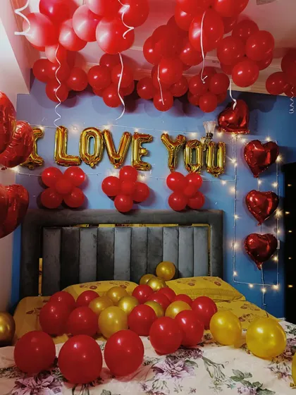 This is another angle of our "I LOVE YOU" room decoration, showing how fairy lights and heart-shaped foil balloons can be added to enhance the romantic mood for a special surprise.