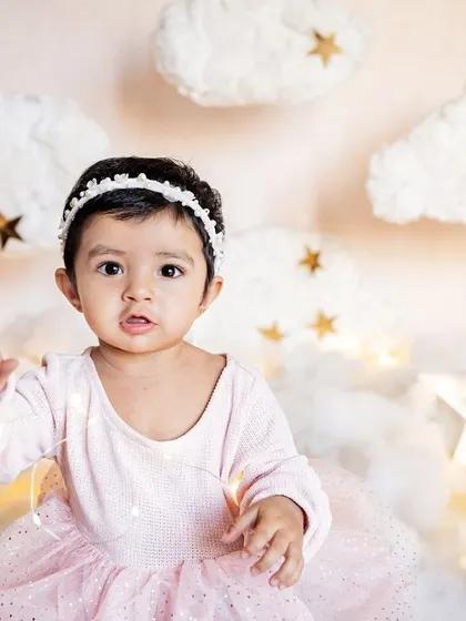 Welcome to dreamland. This "above the clouds" first birthday setup was designed for little Taarika, whose name means star. I love creating these magical scenes at home.