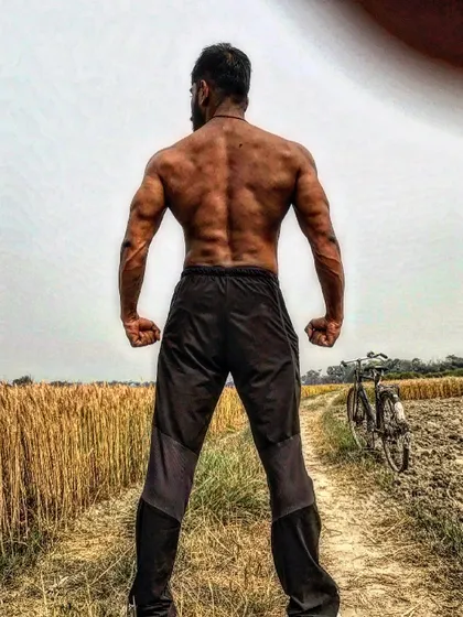 A strong back built not just in the gym, but with the discipline of a desi lifestyle. The fields are my backdrop, and hard work is my equipment.