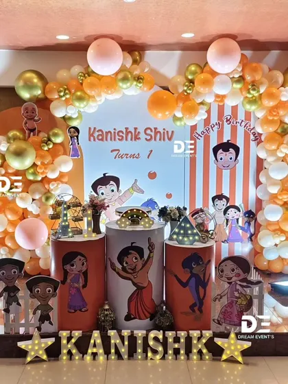 A fun-filled Chhota Bheem party for Kanishk's first birthday. The orange and gold balloon arch perfectly complements the characters from Dholakpur.