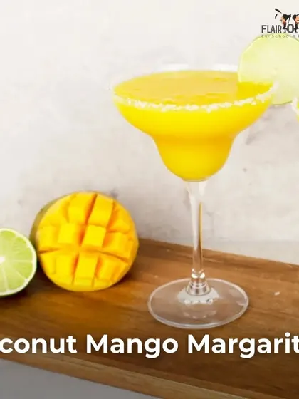 A stunning Coconut Mango Margarita. This image celebrates World Cocktail Day with a tropical, AAM-zing twist on a classic.