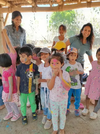 A group photo of our happy, color-streaked adventurers and their teachers. These shared experiences create a strong sense of community and lasting memories.
