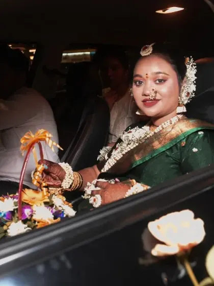 The arrival of the mom-to-be. This candid shot captures her arriving at the baby shower venue, looking radiant in her traditional attire.