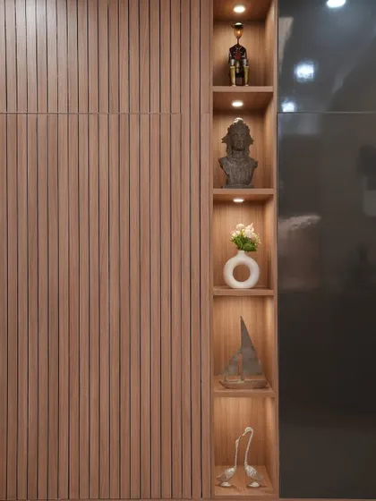 This gorgeous wooden display unit turns a plain wall into a beautiful focal point. The fluted paneling adds warmth and texture, while the illuminated niches are perfect for showcasing treasured decor items.