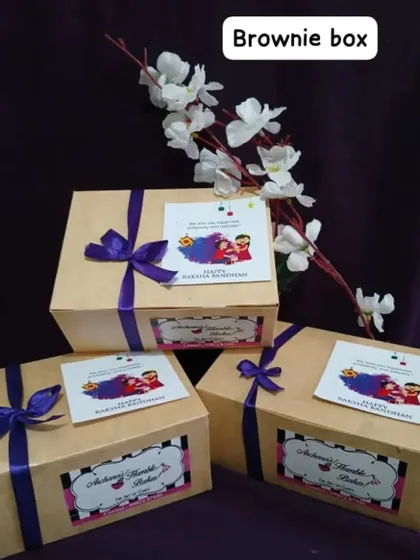 My classic brownie boxes get a festive makeover for Raksha Bandhan. These simple yet elegant boxes are tied with a ribbon and come with a 'Happy Raksha Bandhan' card, ready for gifting.