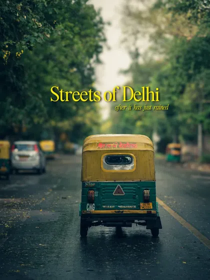 The streets of Delhi just after it has rained. The wet roads reflect the sky and the city lights, creating a moody and cinematic version of the familiar landscape.
