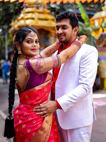 An outdoor couple shoot with a traditional temple chariot in the background. I enjoy finding unique backdrops that add cultural context and visual interest to your photos.