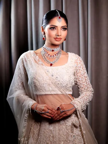Another beautiful portrait of the bride in her white lehenga. The makeup is designed to be timeless, ensuring she looks back at her photos with love for years to come.