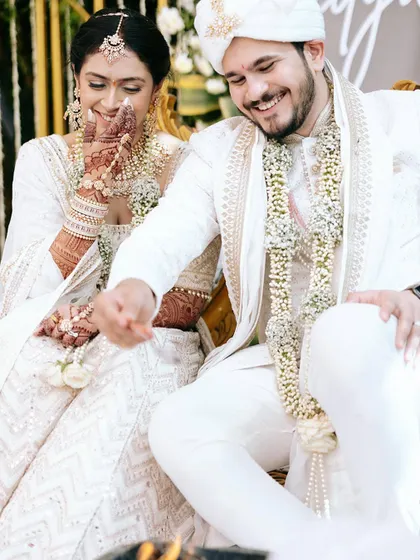 A candid moment of laughter and fun during the wedding rituals. These are the memories that couples cherish the most.