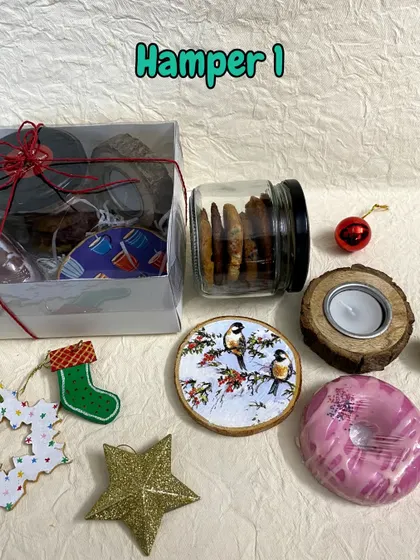 One of my Christmas and New Year gift hamper options, including cookies, camel milk soap, a wooden coaster, and a T-light holder.