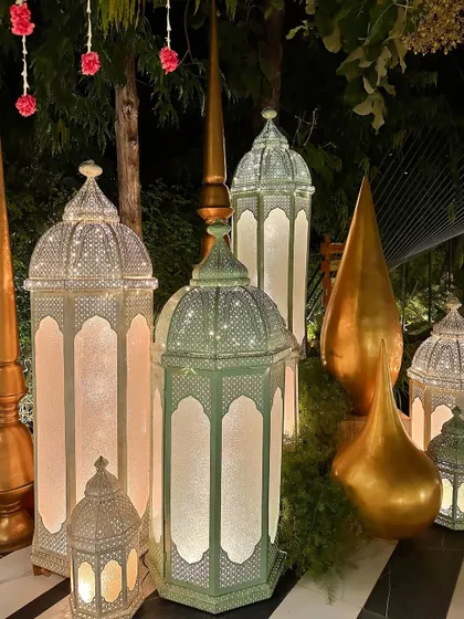 A collection of our large Moroccan-style lanterns and golden spires, creating a grand statement.