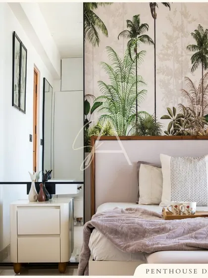 A detail from one of the penthouse bedrooms, where a nature-inspired wallpaper serves as a beautiful feature wall. It brings a sense of the outdoors in, complementing the room's otherwise clean and minimal design.