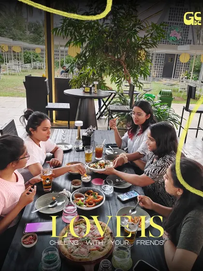 Love is chilling with your friends. A group of girls enjoying a meal and good conversation.