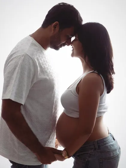 Just the two of you, waiting for the little one. This backlit silhouette is a beautiful and intimate way to capture the connection and anticipation you share as a couple.