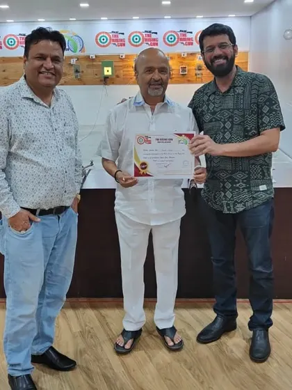 An adult student is awarded his certificate after finishing the basic course. It's never too late to learn a new skill, and shooting is a fantastic way to improve focus and discipline.