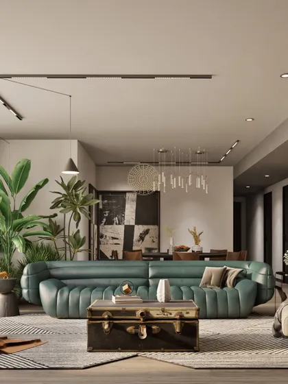 For this Kolkata living room, the client wanted a warm and stylish space. A statement green tufted sofa is paired with a vintage trunk coffee table, creating a collected-over-time feel. Large indoor plants bring life and vibrancy to the room.