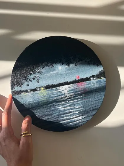 Another shot of me holding the round nightscape painting.