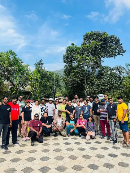 The full group from a Netravathi trek, posing together at the homestay.