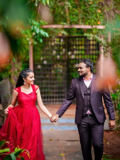A romantic walking shot of a couple hand-in-hand, with a soft, dreamy focus that highlights their connection.