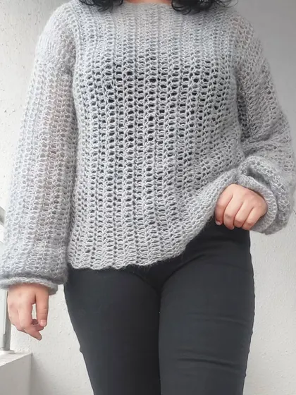Working with delicate mohair yarn for the Vevitha Sweater was a fantastic challenge. My testing process focused on ensuring the pattern's stitch counts were accurate for such a fine-weight yarn and that the instructions for the balloon sleeves created the intended soft, airy effect.