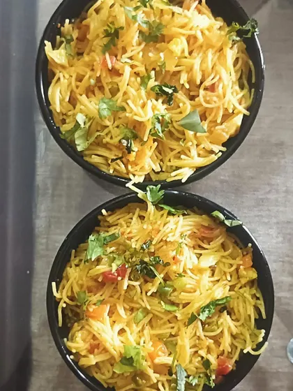 Two bowls of my homemade vegetable vermicelli (seviyan upma). It's a light, healthy, and tasty breakfast option.