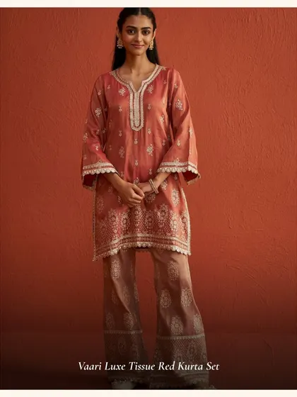 The Vaari Luxe Tissue Red Kurta Set is a beautiful muted red, perfect for those who want a sophisticated festive look. The tissue fabric gives it a lovely sheen.