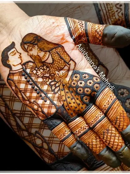 A close-up of a romantic couple portrait on the palm. This is a popular request for bridal mehndi, and a key technique we cover in the figure art course.