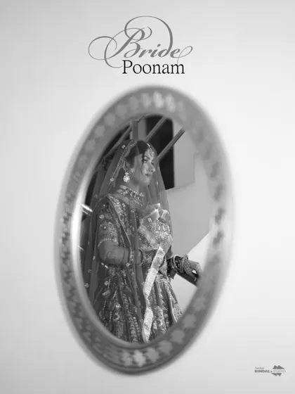 An artistic black and white shot of the bride's reflection in a mirror. The motion blur adds a dreamy, ethereal quality to this creative portrait.