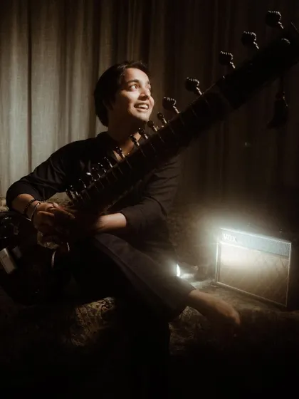 A smile during a photoshoot. Even in posed pictures, I try to let the joy I feel for music shine through.