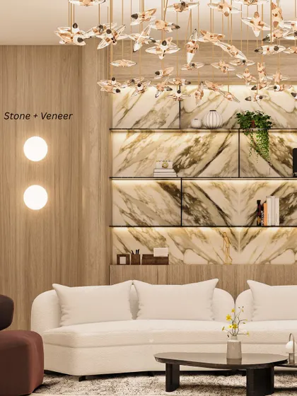 Stone + Veneer: Pairing stone with wood veneer brings depth and grounded elegance. In this living room, a marble display wall is beautifully complemented by warm wood paneling.